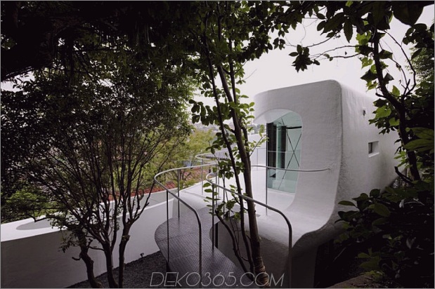 futuristisch-gekrümmtes-wandhaus integriert-nature-and-architecture-5.jpg