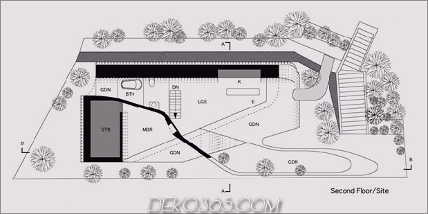 futuristisch-gekrümmtes-wandhaus integriert-natur-und-architektur-25.jpg
