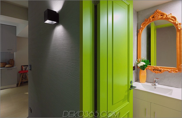 ganna-design-modernisiert-a-small-taiwanese-apartment-orange-powder-room-mirror.jpg