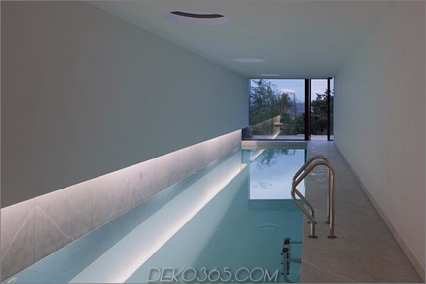 black-home-with-bright-interior-einbau in grasige hügel-29-pool-outward.jpg
